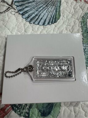 COACH Clear Silver Glitter snow globe bag tag